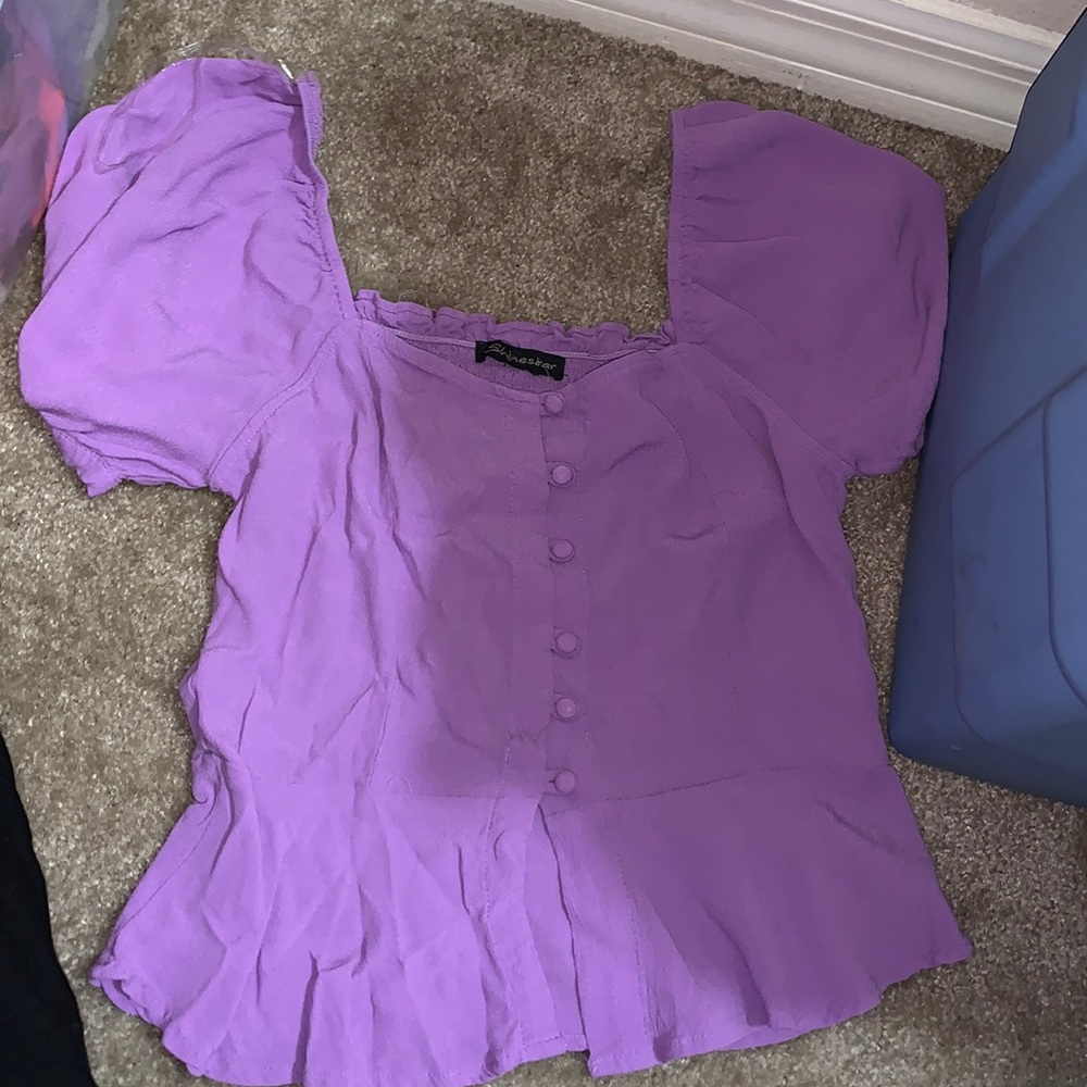 Purple woman’s size small blouse.